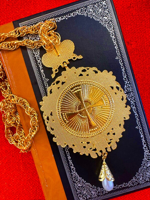 Formal pectoral cross pendant with enameled icon of the Virgin and Jesus.